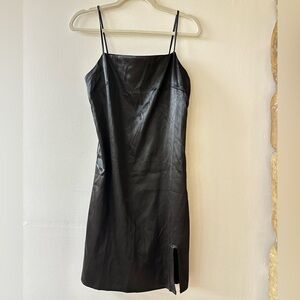 Black silk nightgown-style slip dress with a square neckline and a slit